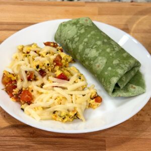 Italian Tofu Scramble on a plate with wrap